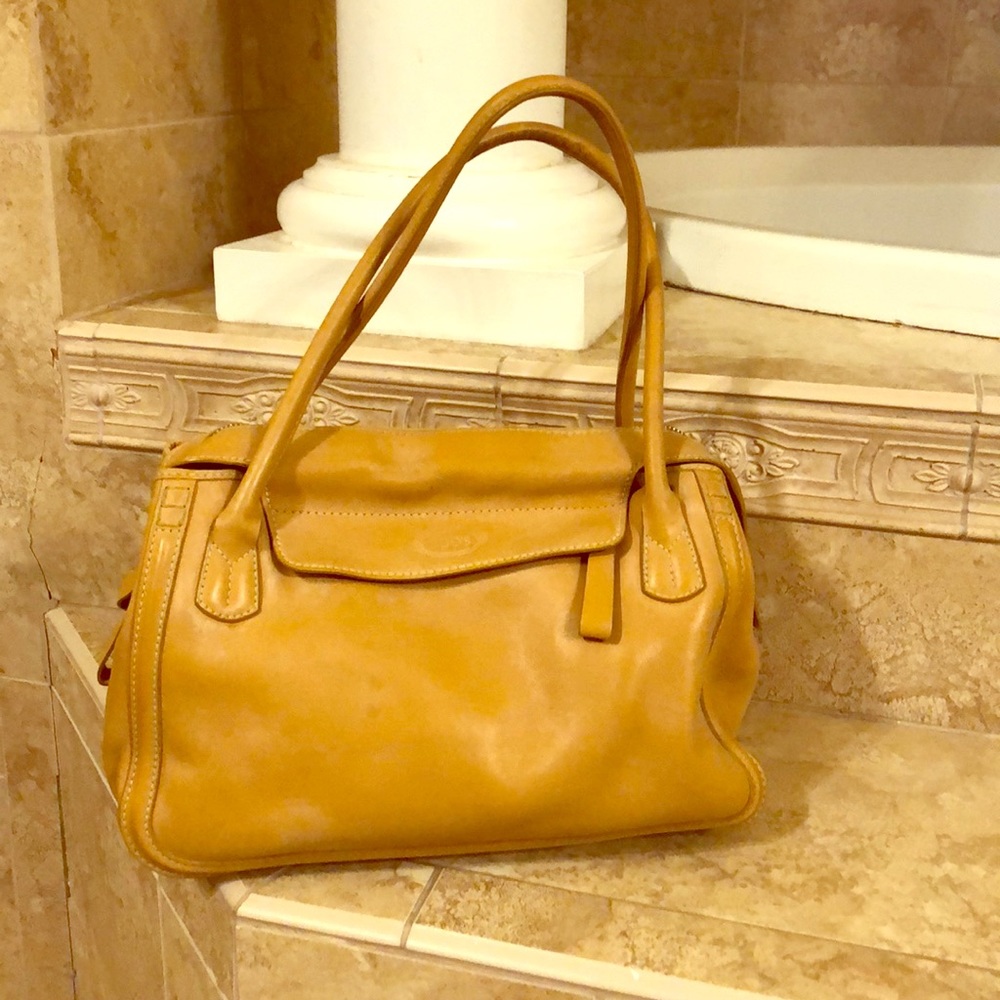 Authentic Tod’s beige purse, in good condition.